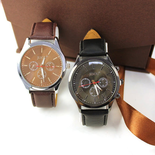 Two watches with brown and black straps on a white background